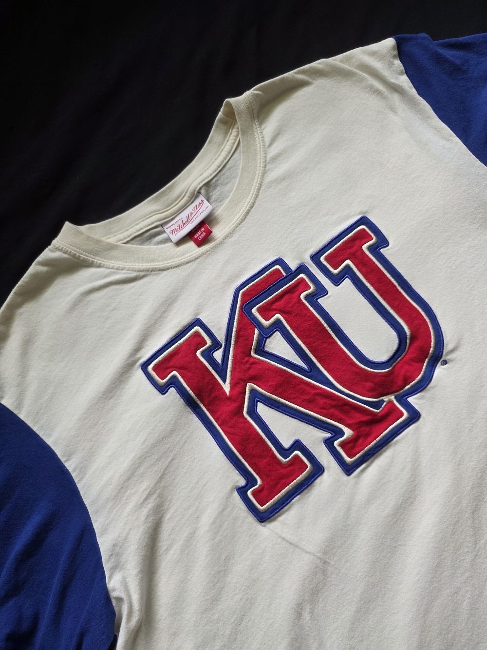 Mitchell & Ness Kansas University Raglan Tee with Blue Sleeves and Red KU Logo